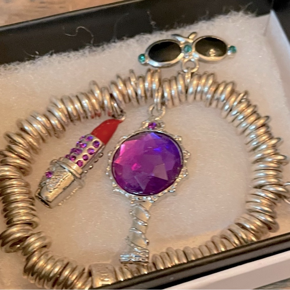 Pandora charm bracelet. Small woman wrist. Four girlie charms attached.